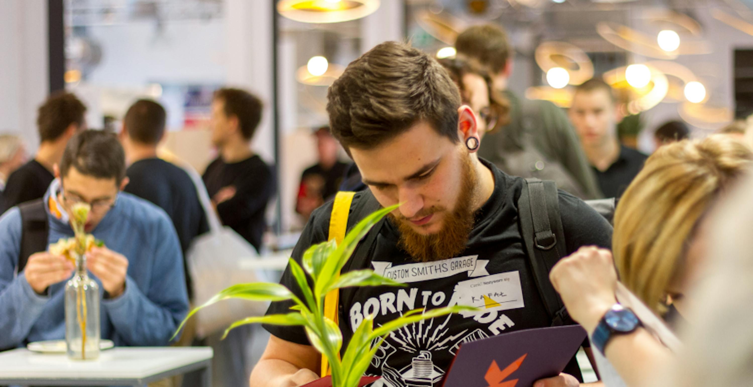 man at conference stand