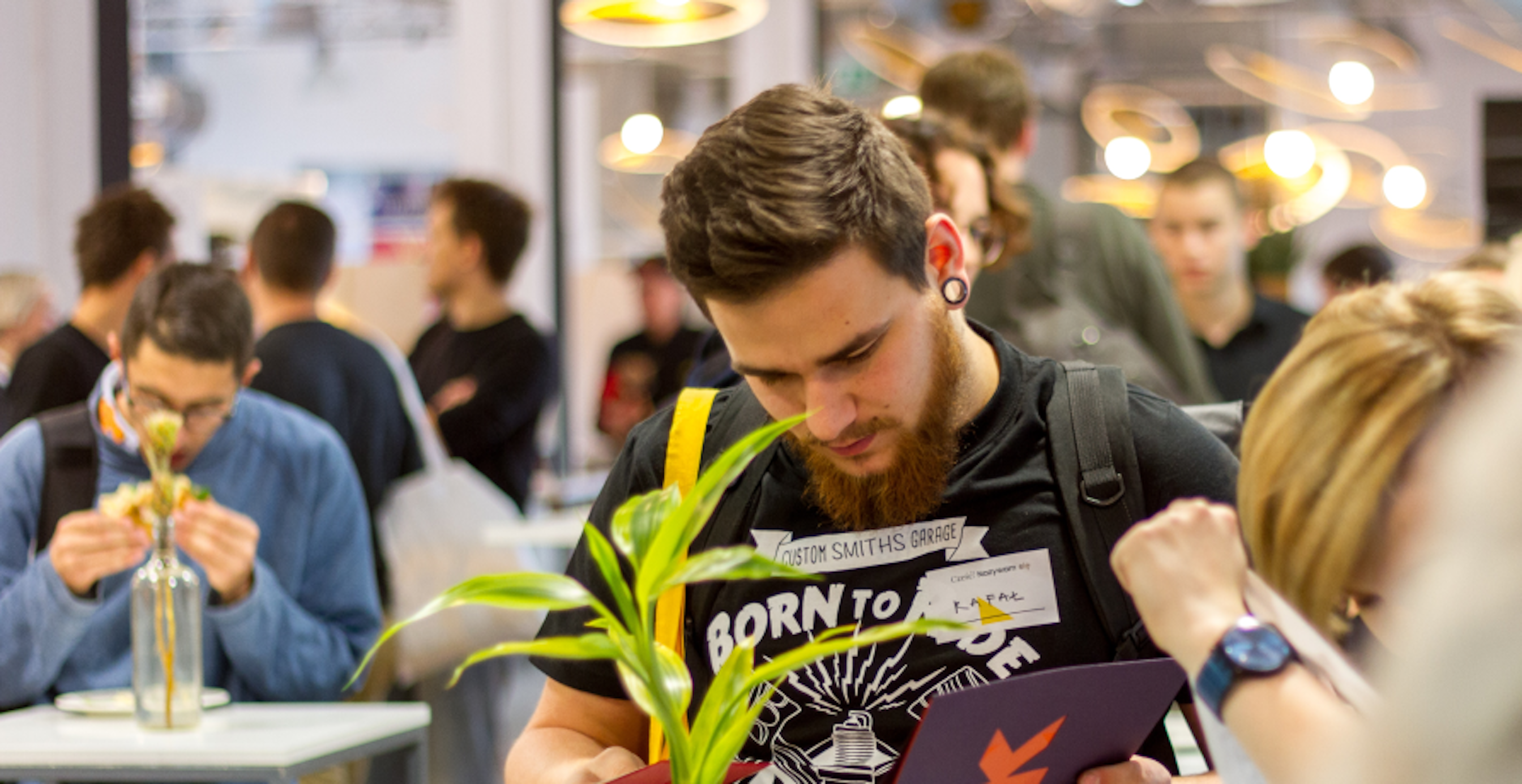 man at conference stand