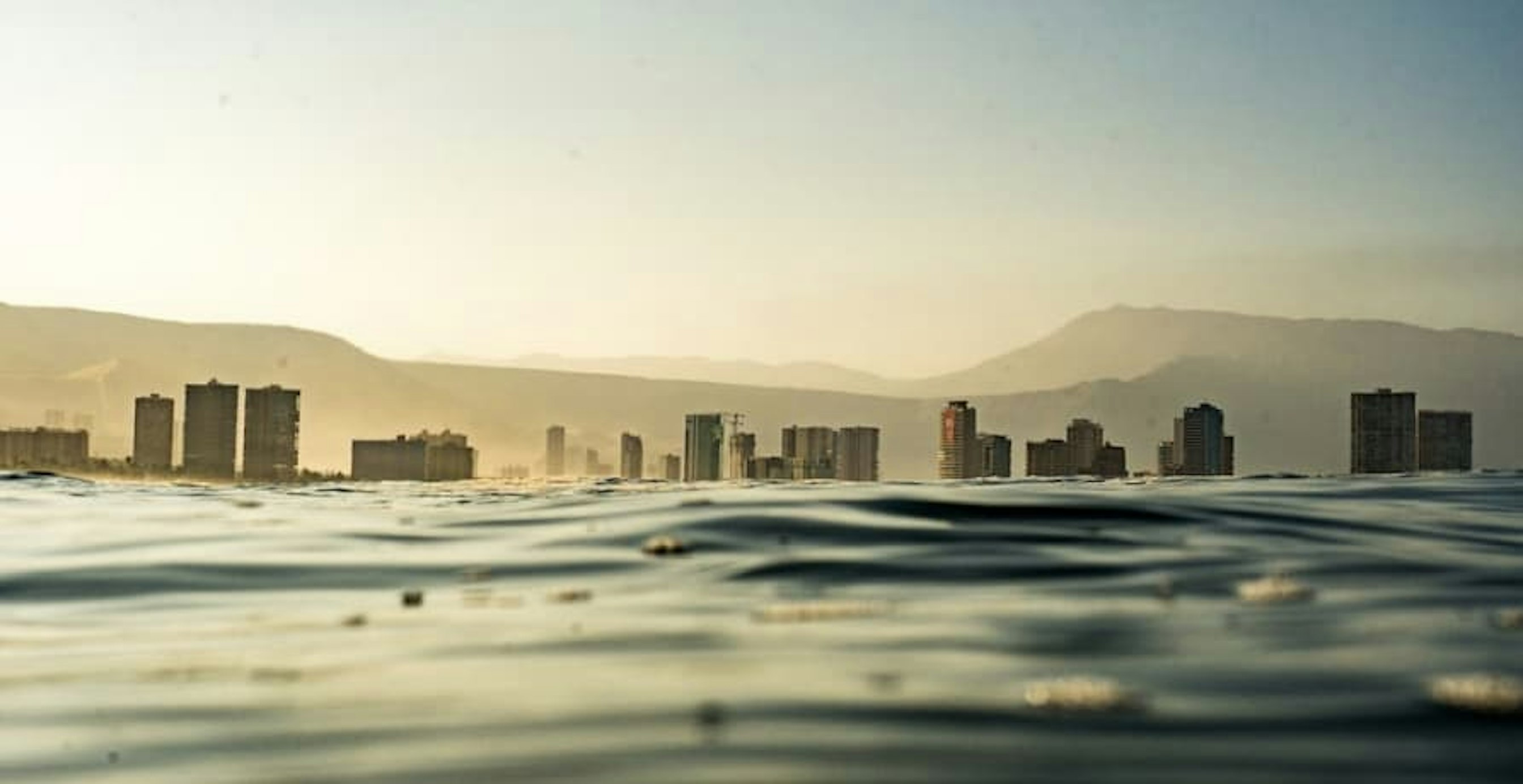 buildings in the distance from out at sea