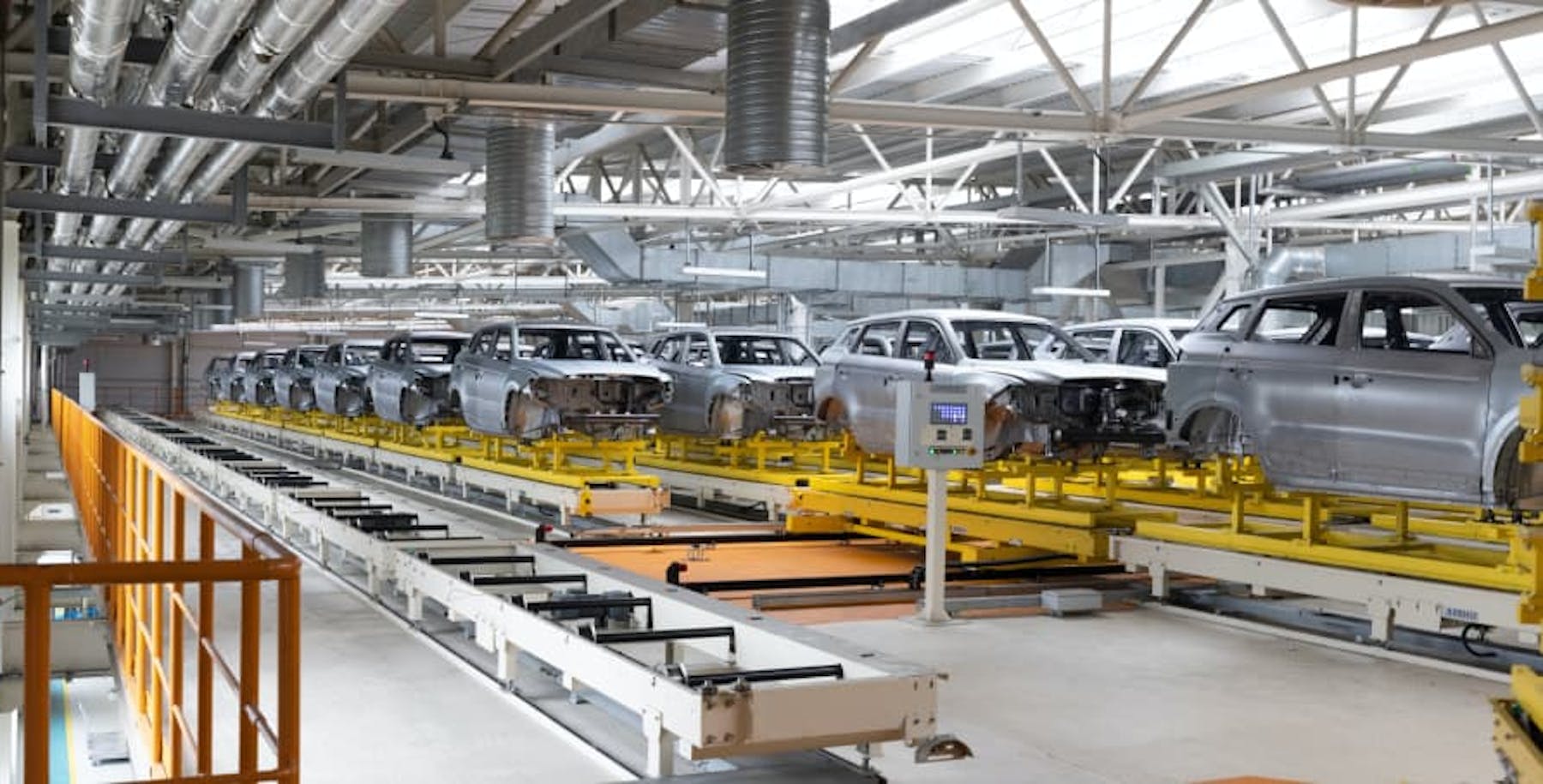 cars being manufactured in warehouse