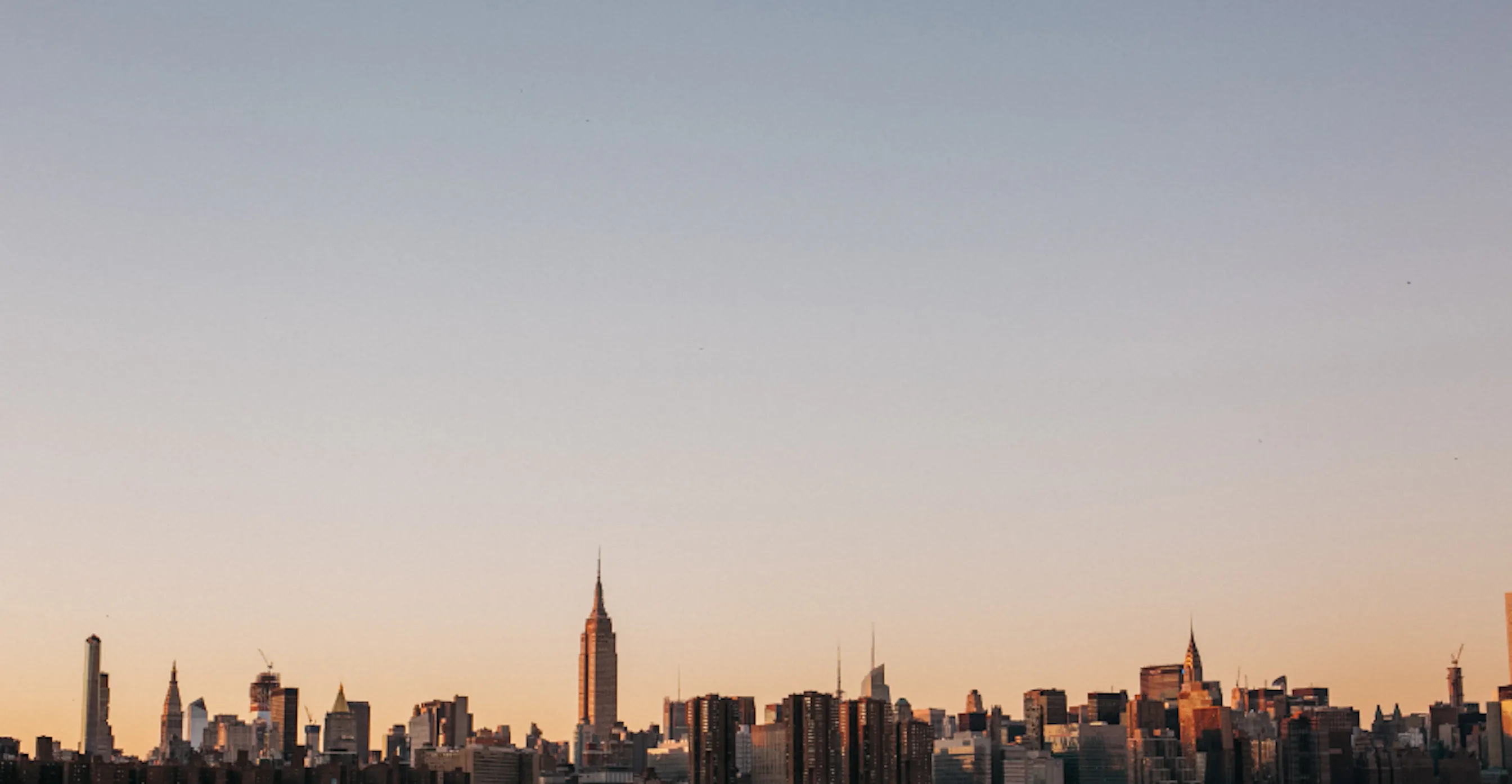 US city skyline representing sustainability reporting regulation