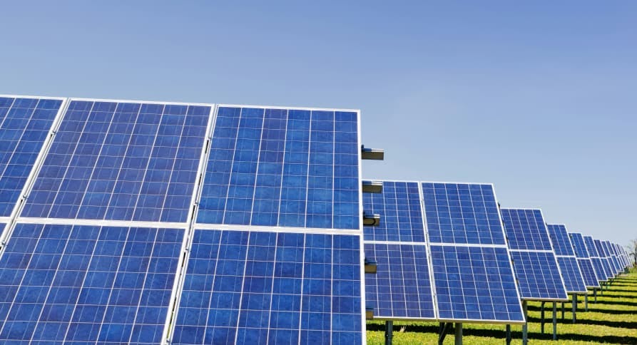 large solar panels in blue sky