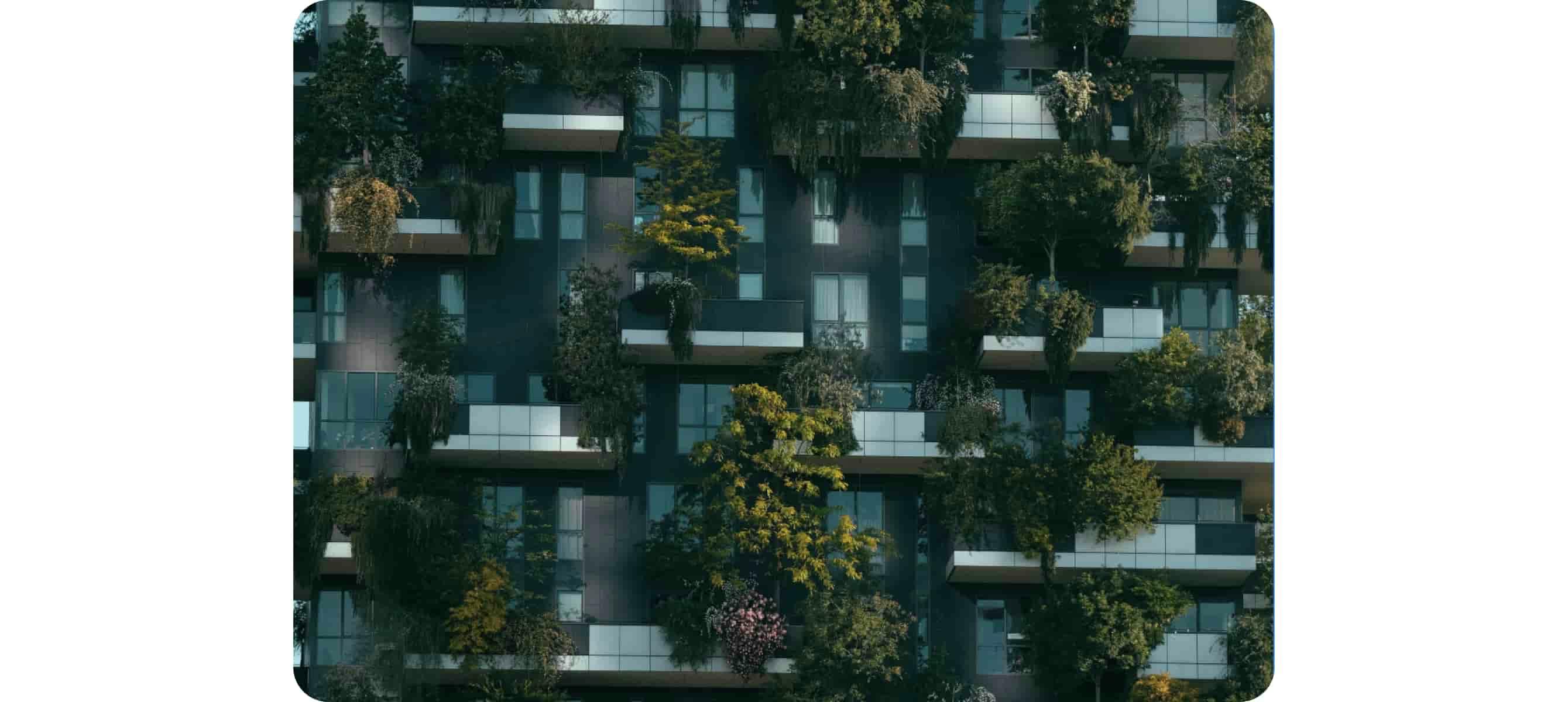 Modern residential building facade decorated with green plants