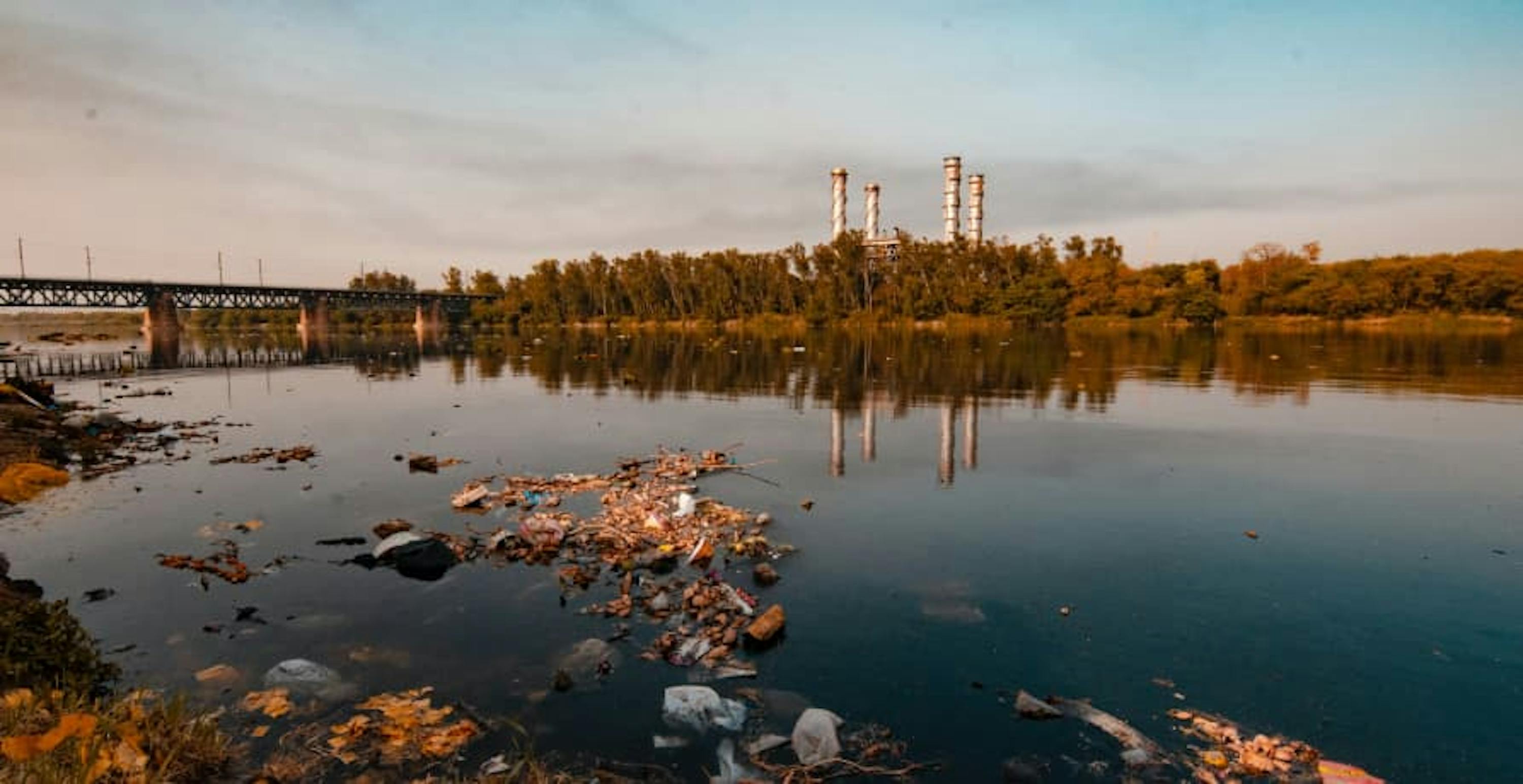 Factory and lake with plastic pollution in India 