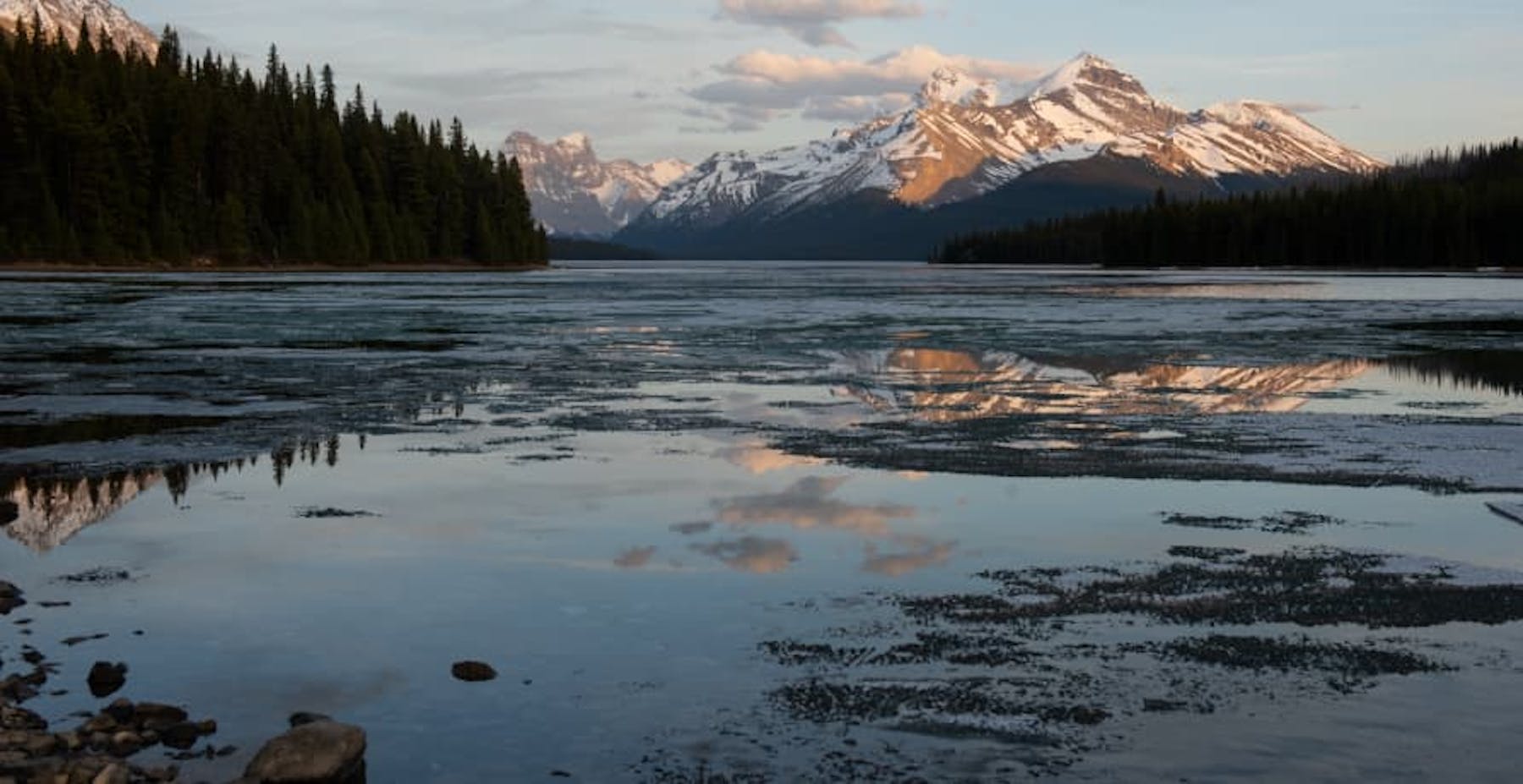 view of lake with snowy mountain ahead