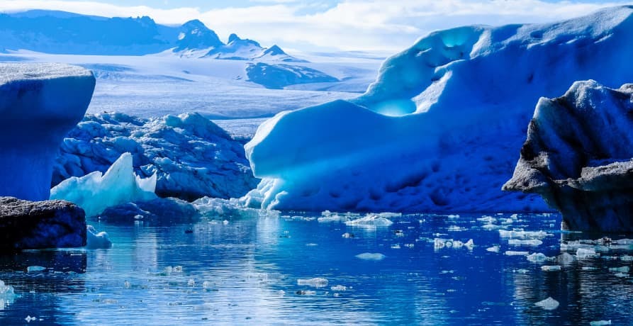 icebergs melting in the ocean water