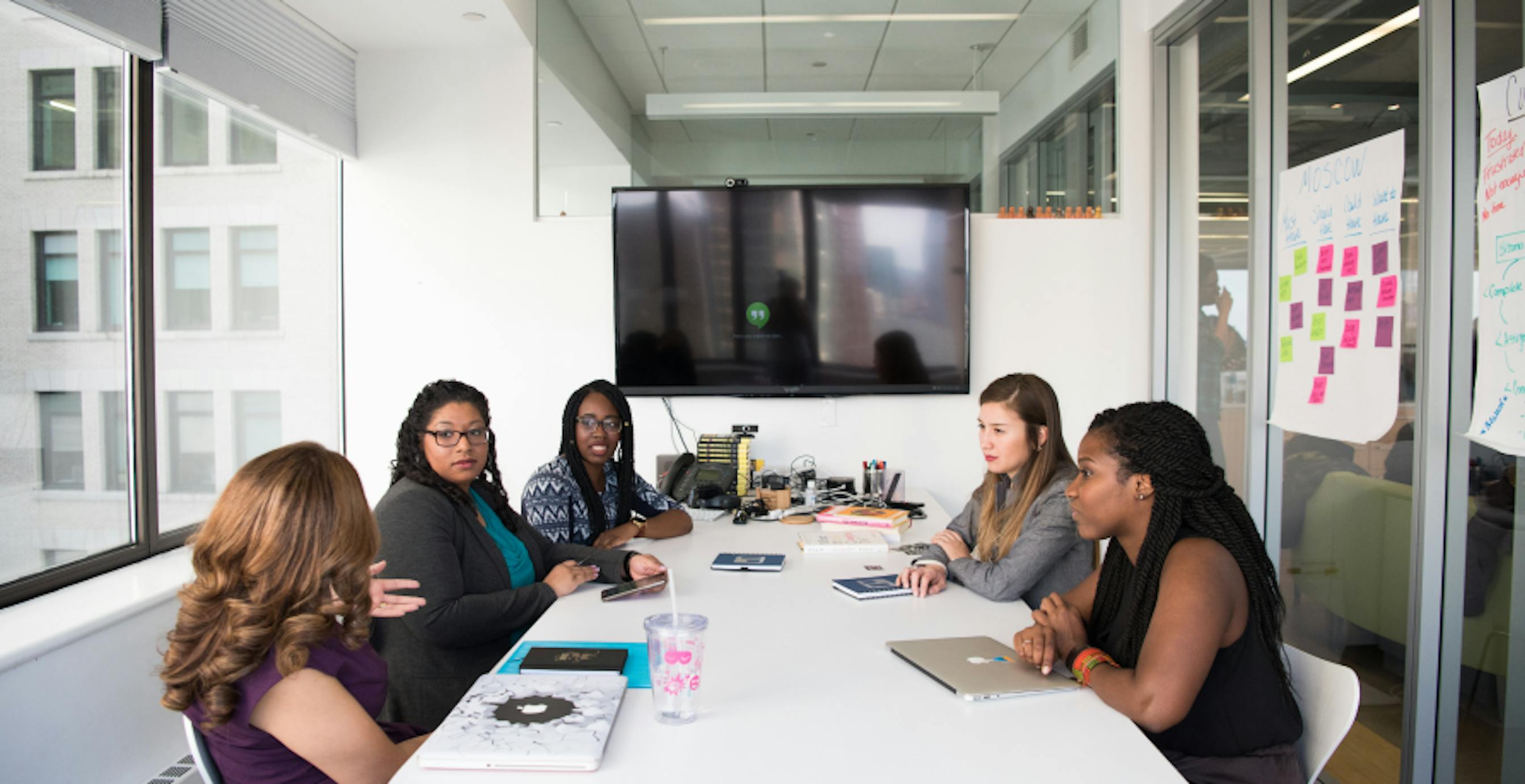 people in a meeting white table