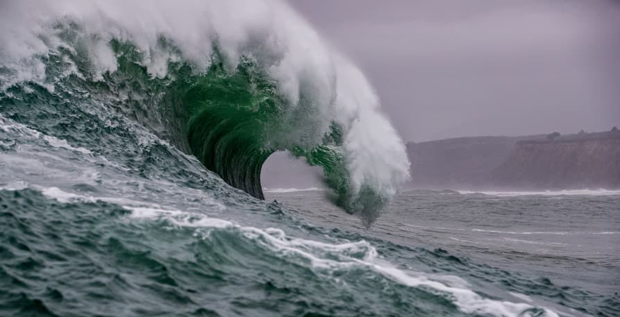 giant ocean wave in grey sky