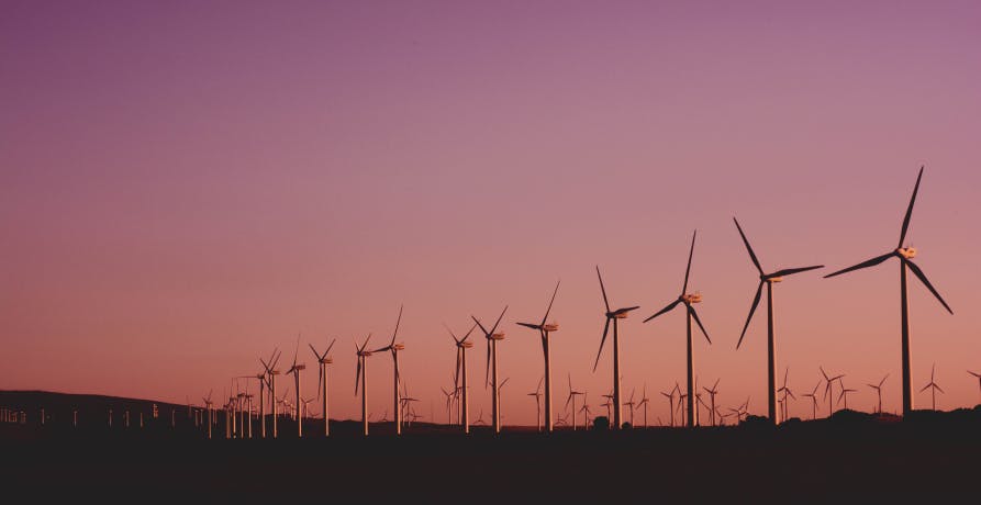 wind farm at sunset in the countryside