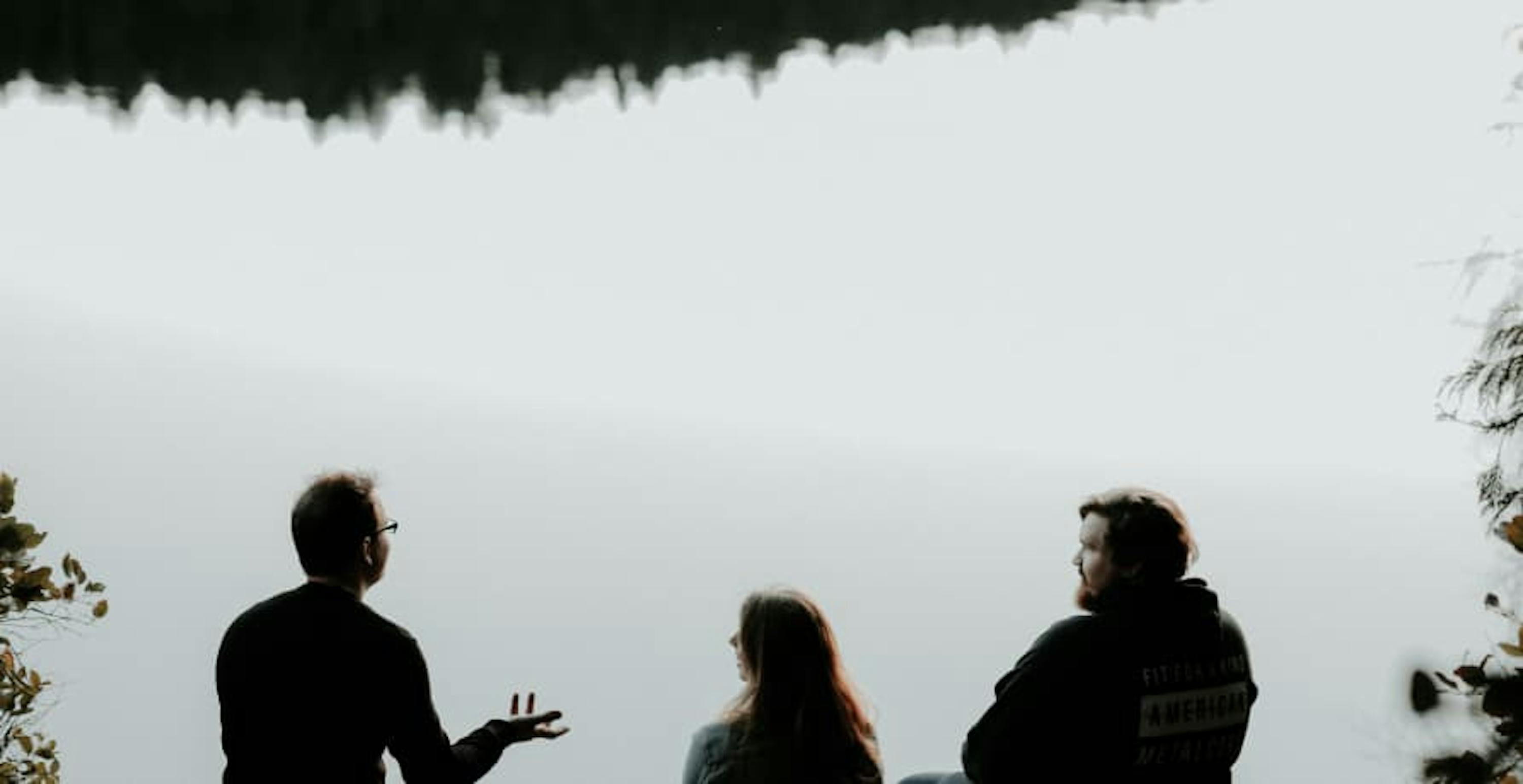 people talking near river