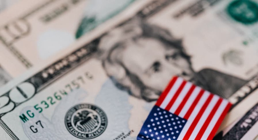 mini american flag over $20 USD bill