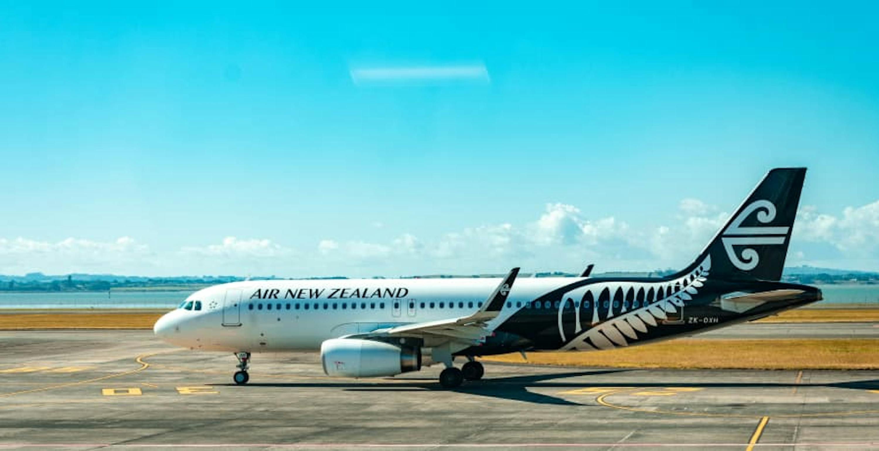 plane sitting on tarmac air new zealand