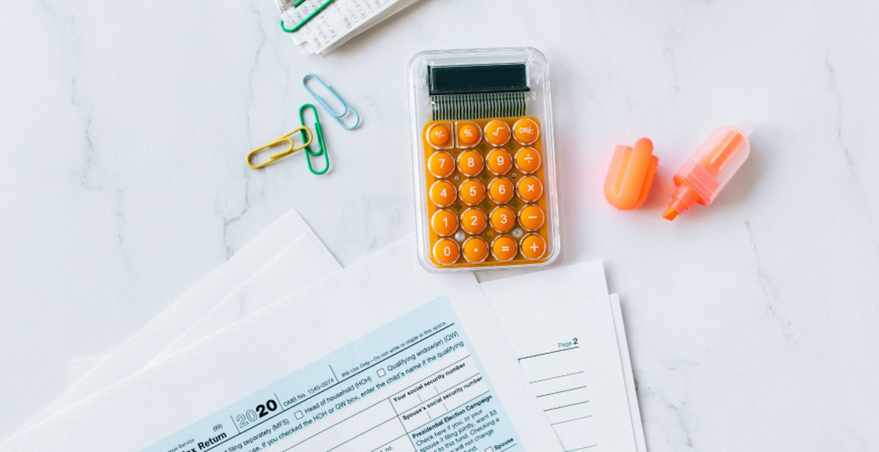 taxes and calculator on table