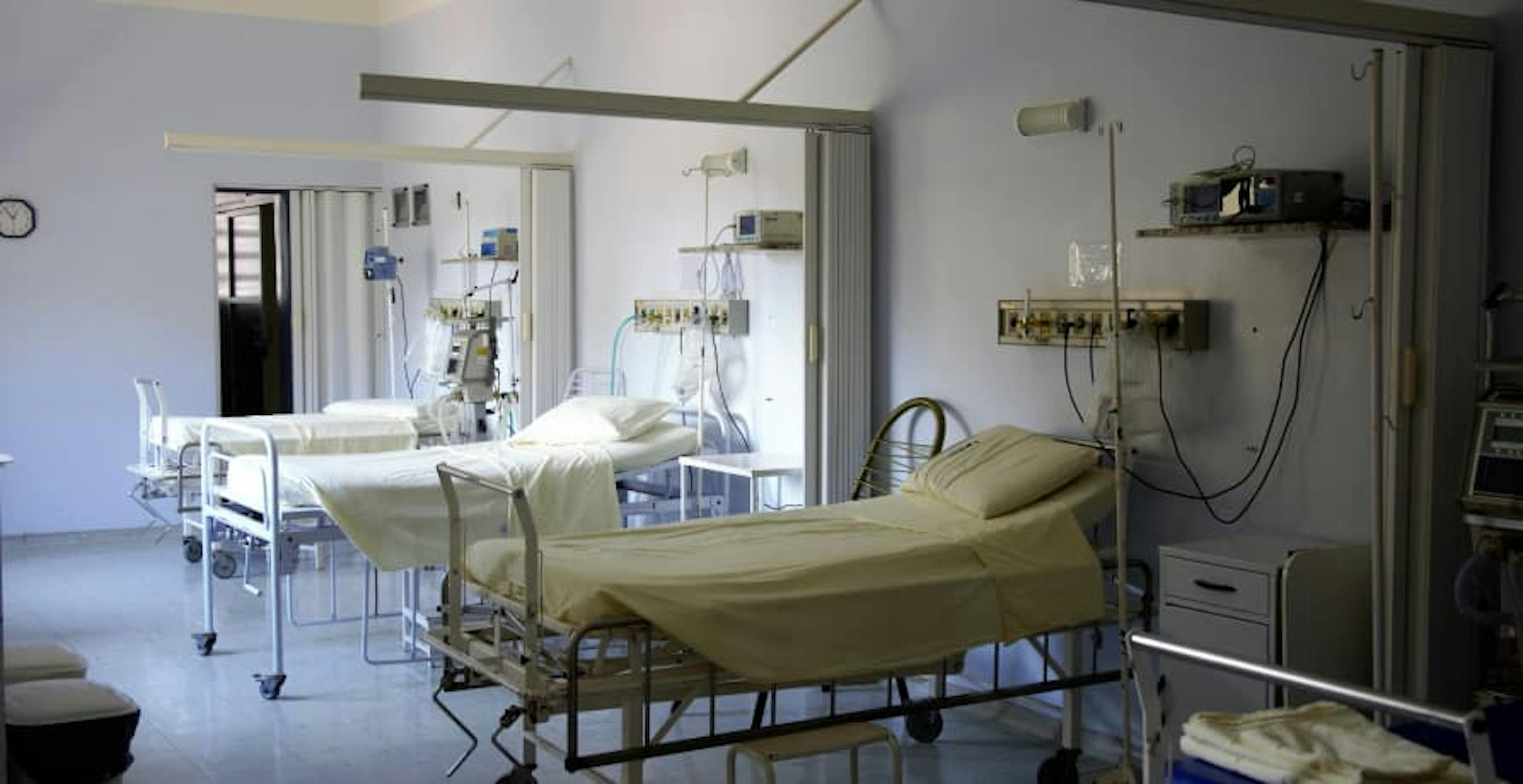 hospital bedroom with two empty beds