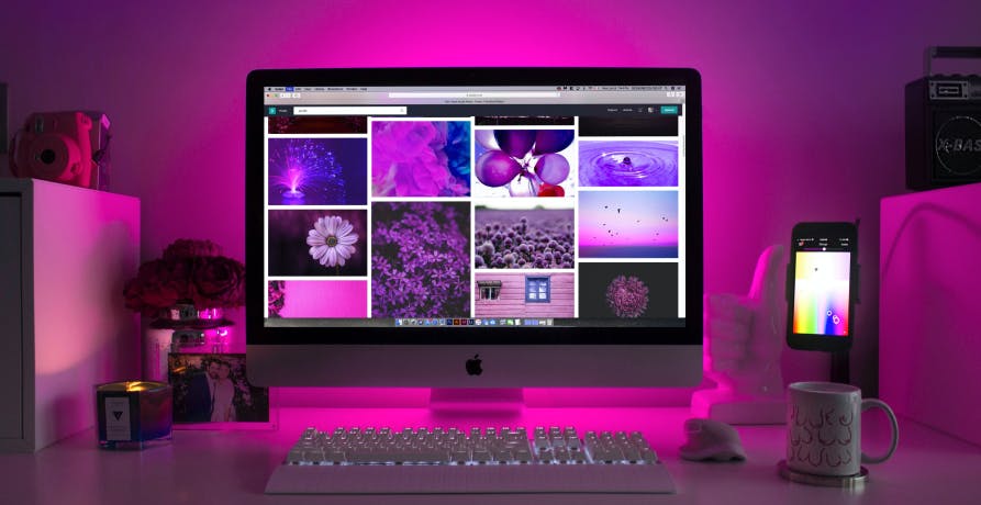 imac setup with purple lighting 