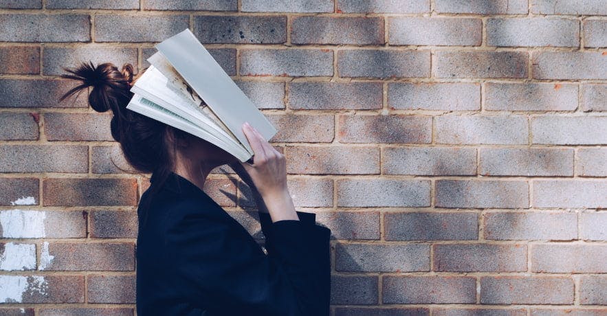 someone handling a book