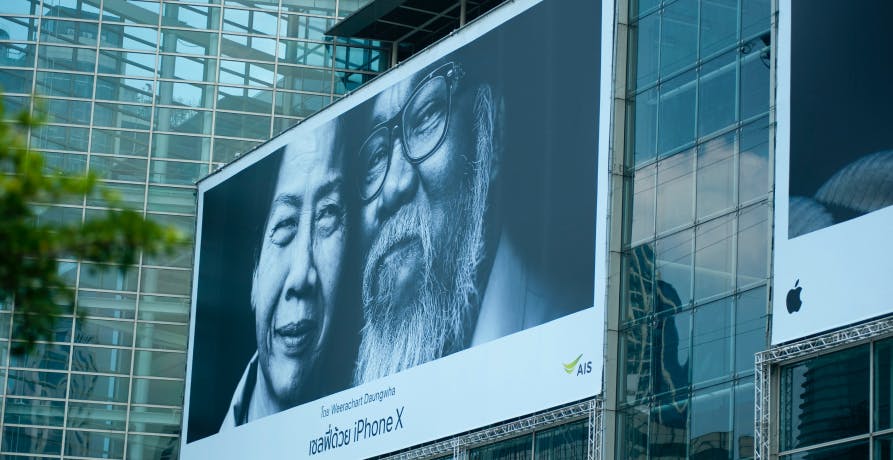 Billboard on glass building wall