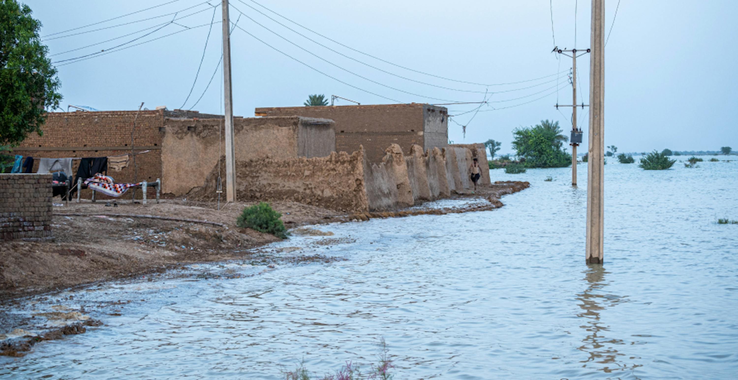 flooded town with houses next to floodwater