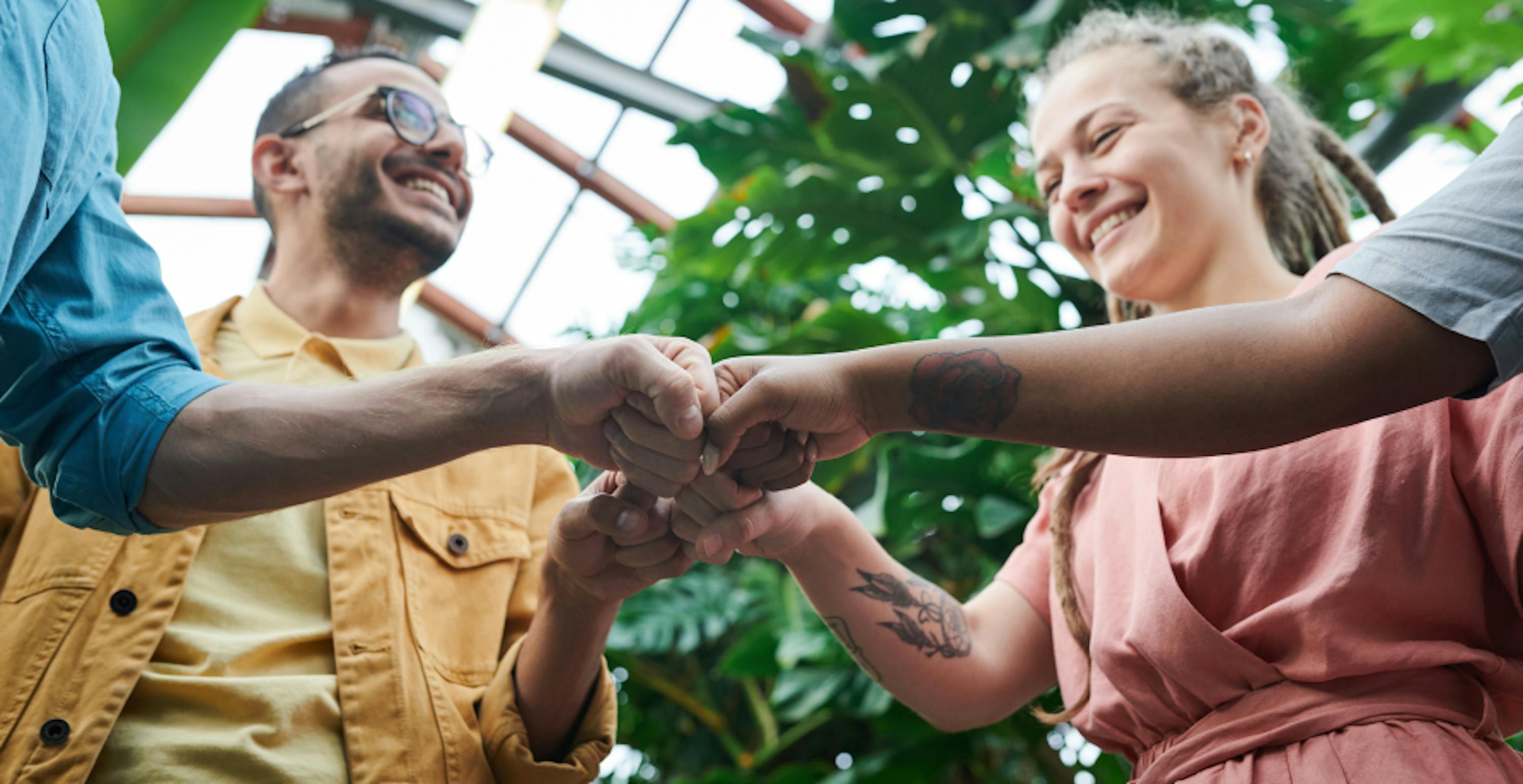 employees giving each other a fist bump