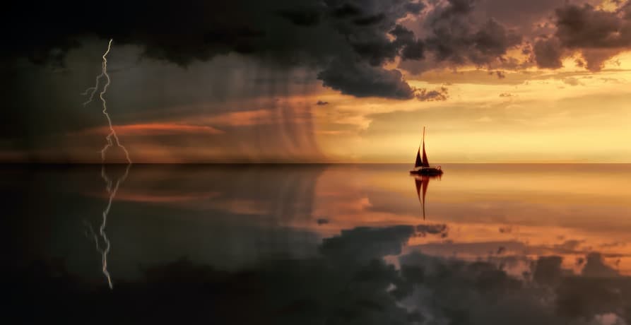 boat on the ocean with storm approaching