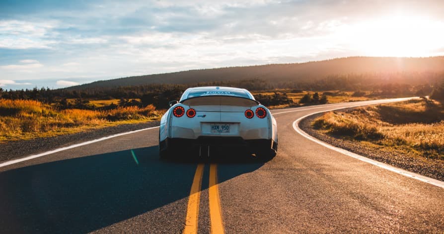 car on open sunny road