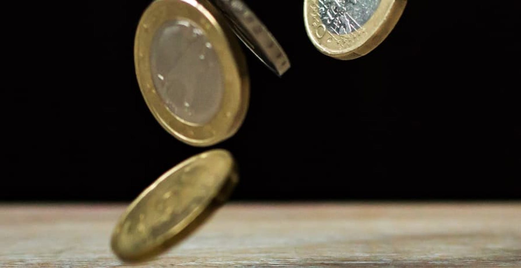 Euro coins falling on the table