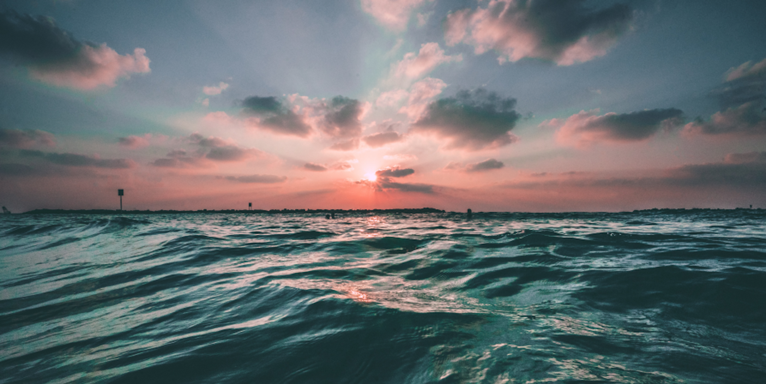 ocean and sun setting