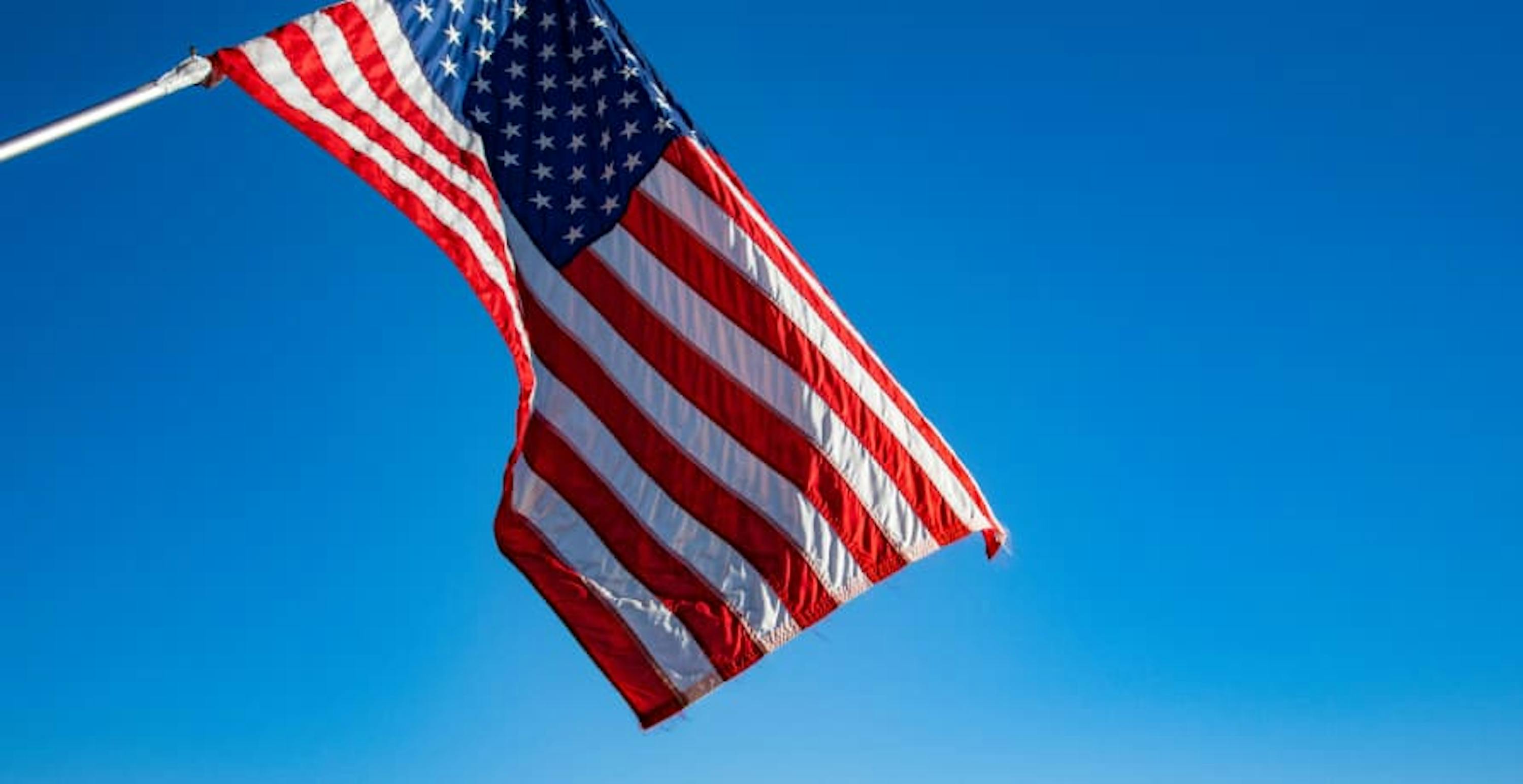 usa flag waving in blue sky