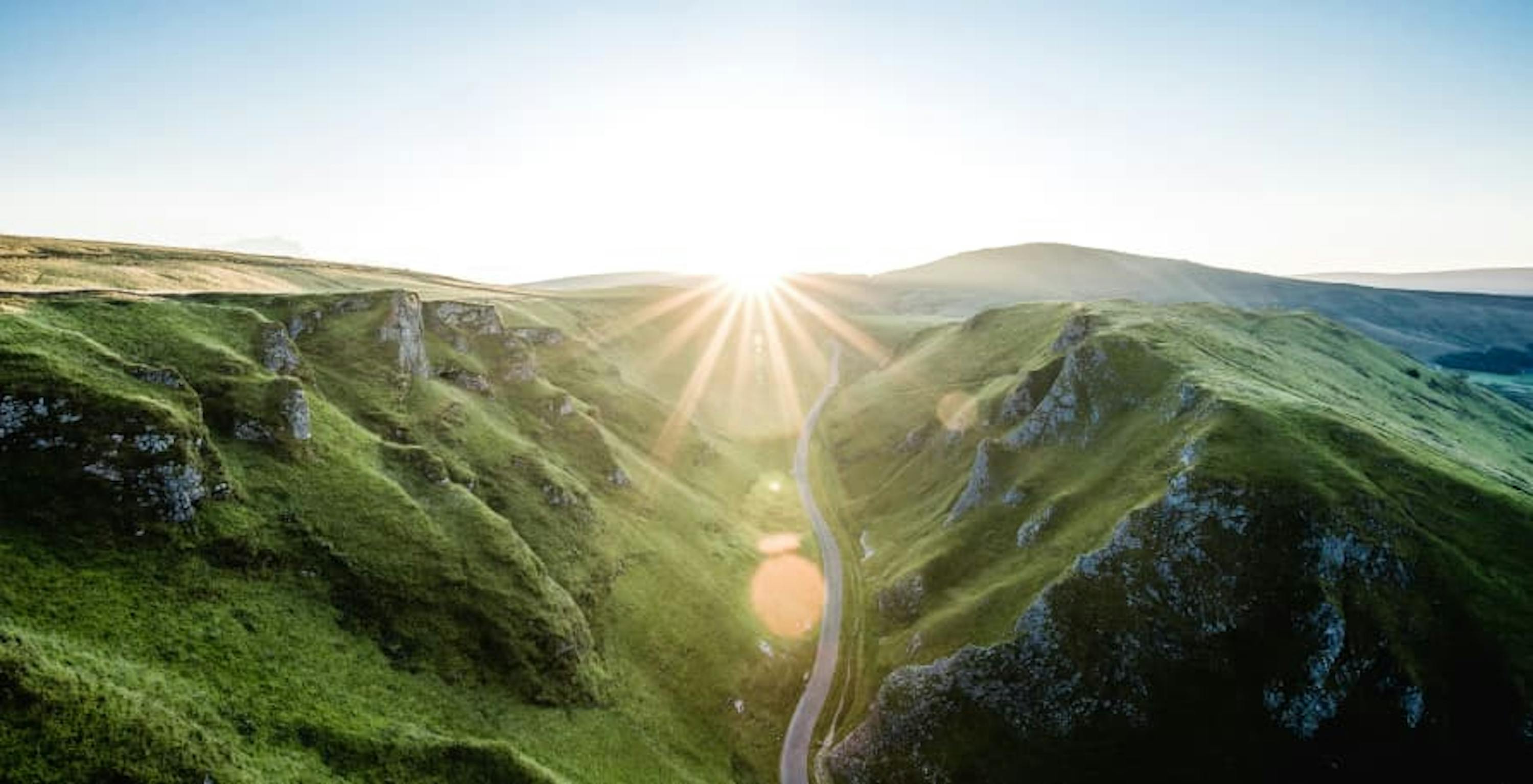 sunlight with lucious green mountains