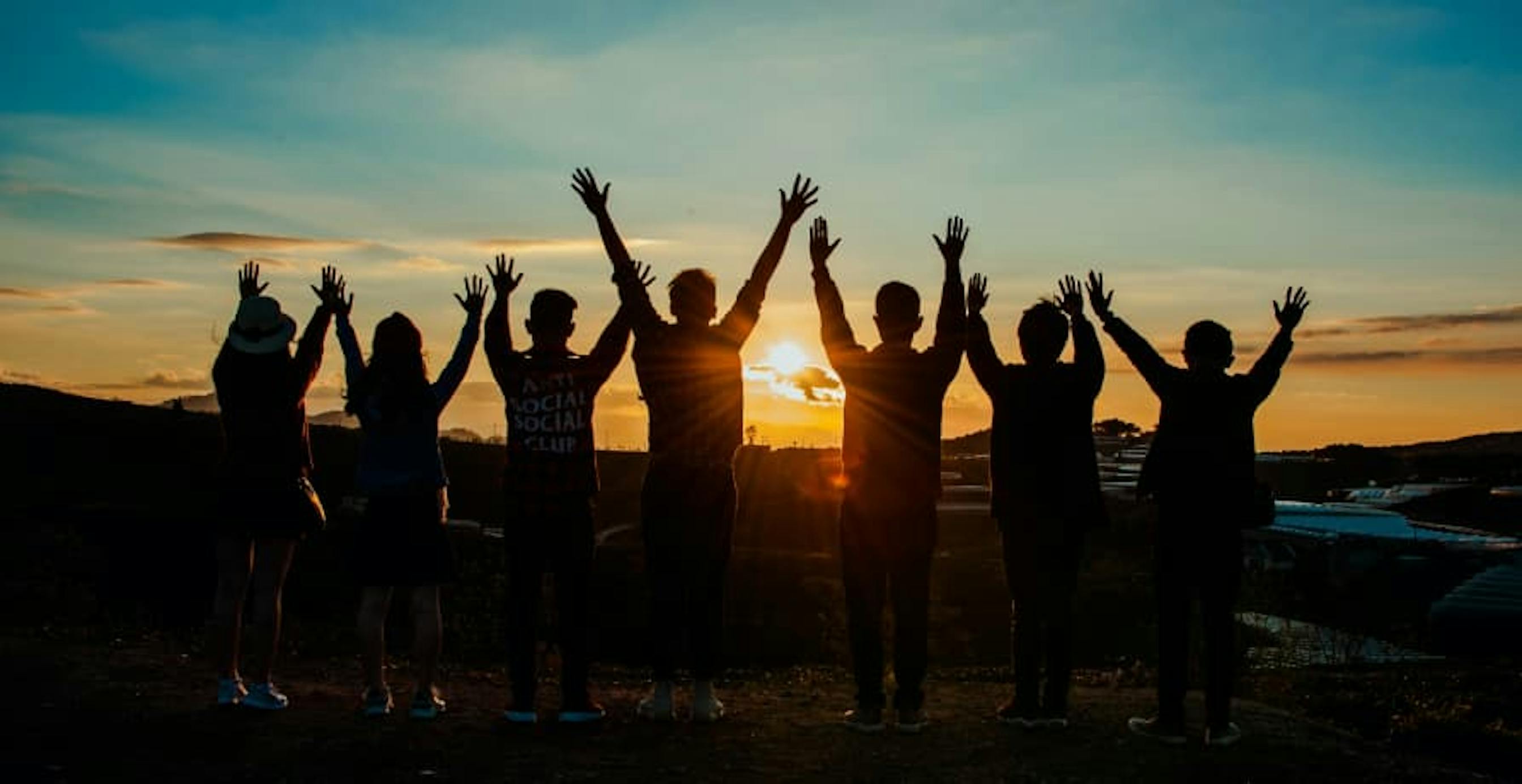 group of people at sunset