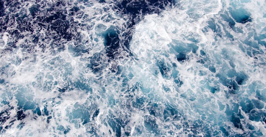 white waves crashing in the ocean