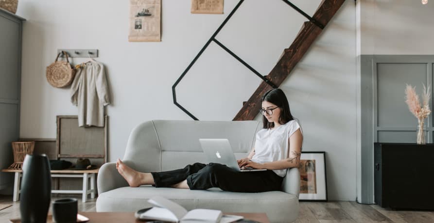 woman working from her sofa