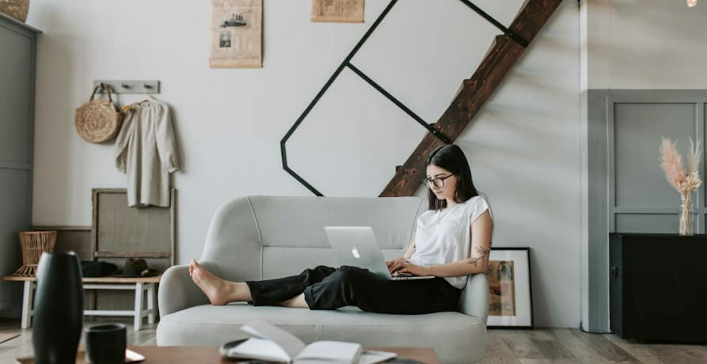 woman on her laptop sitting in her livingroom