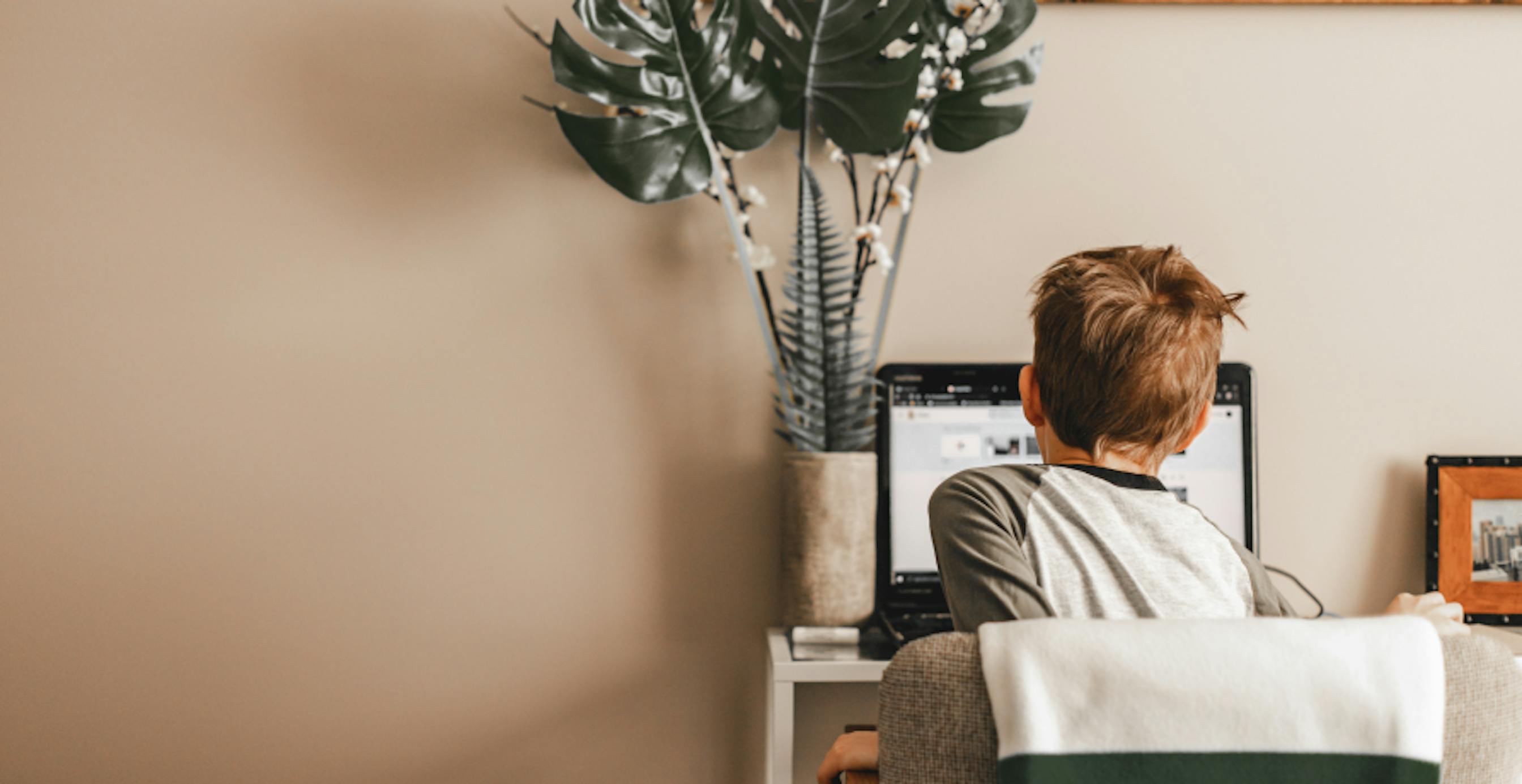 boy sitting at computer desk