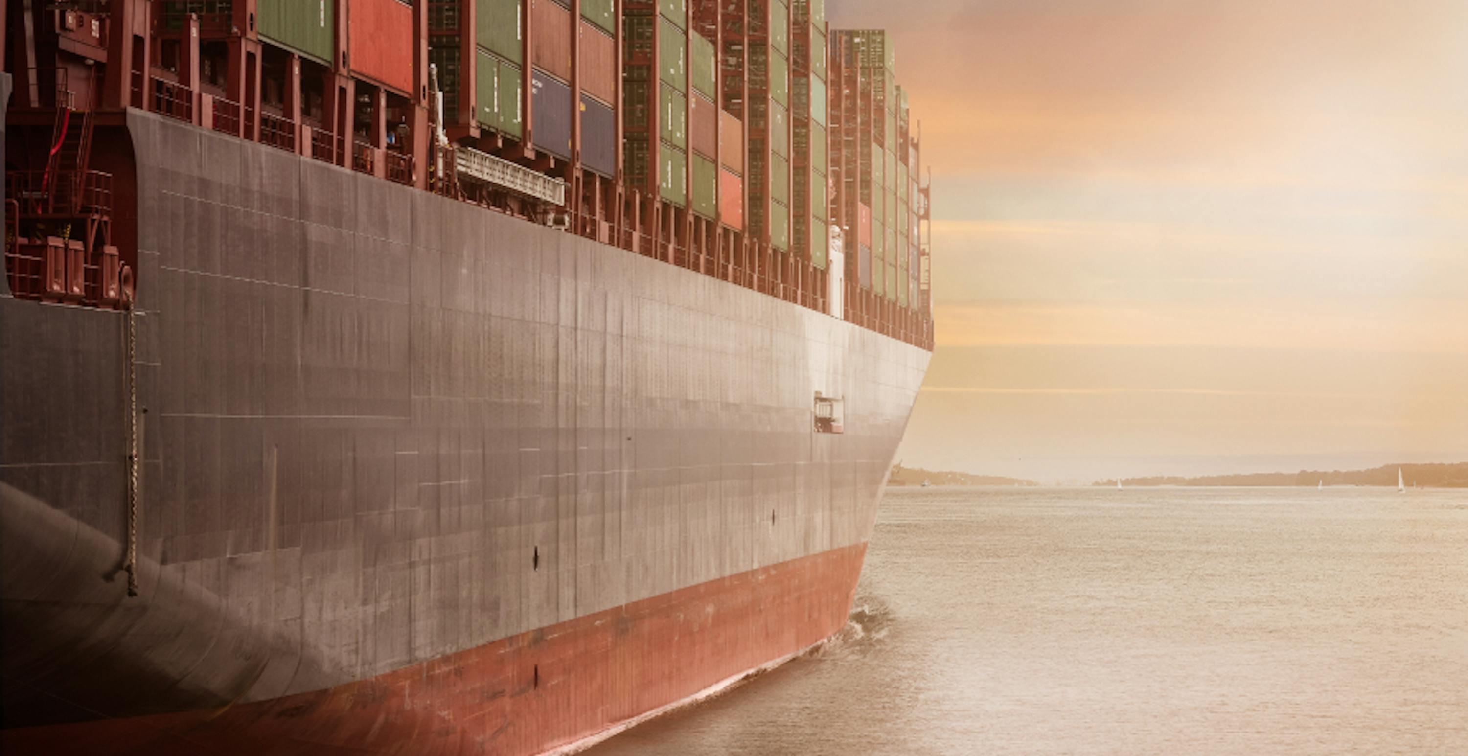 large ship with cargo sailing on the ocean