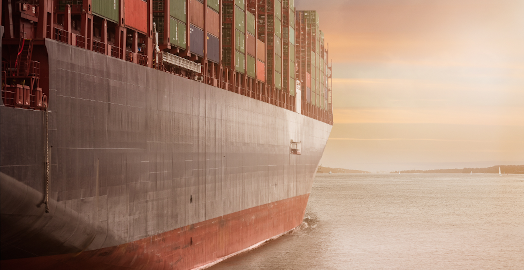 large ship with cargo sailing on the ocean