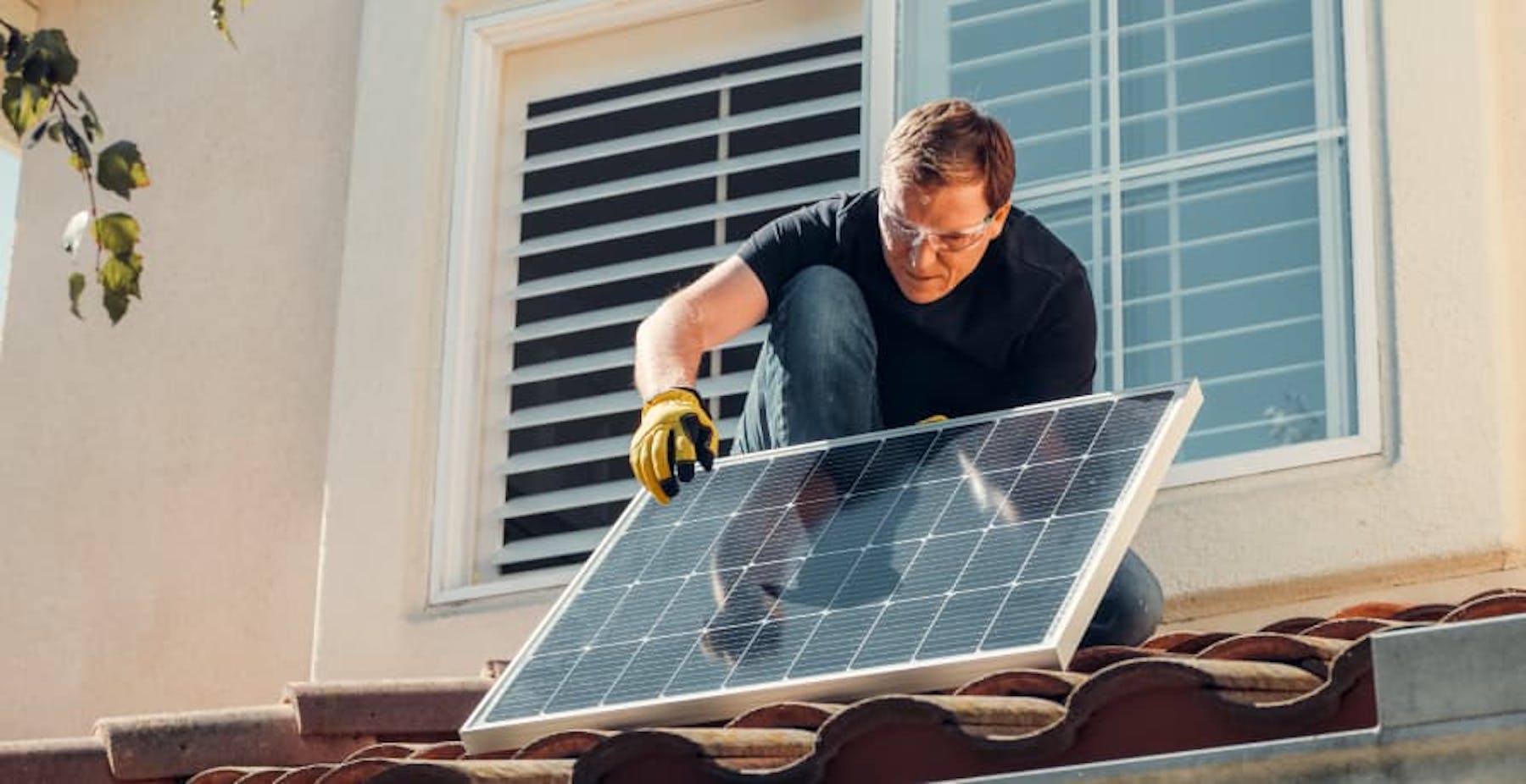 person installing solar panels
