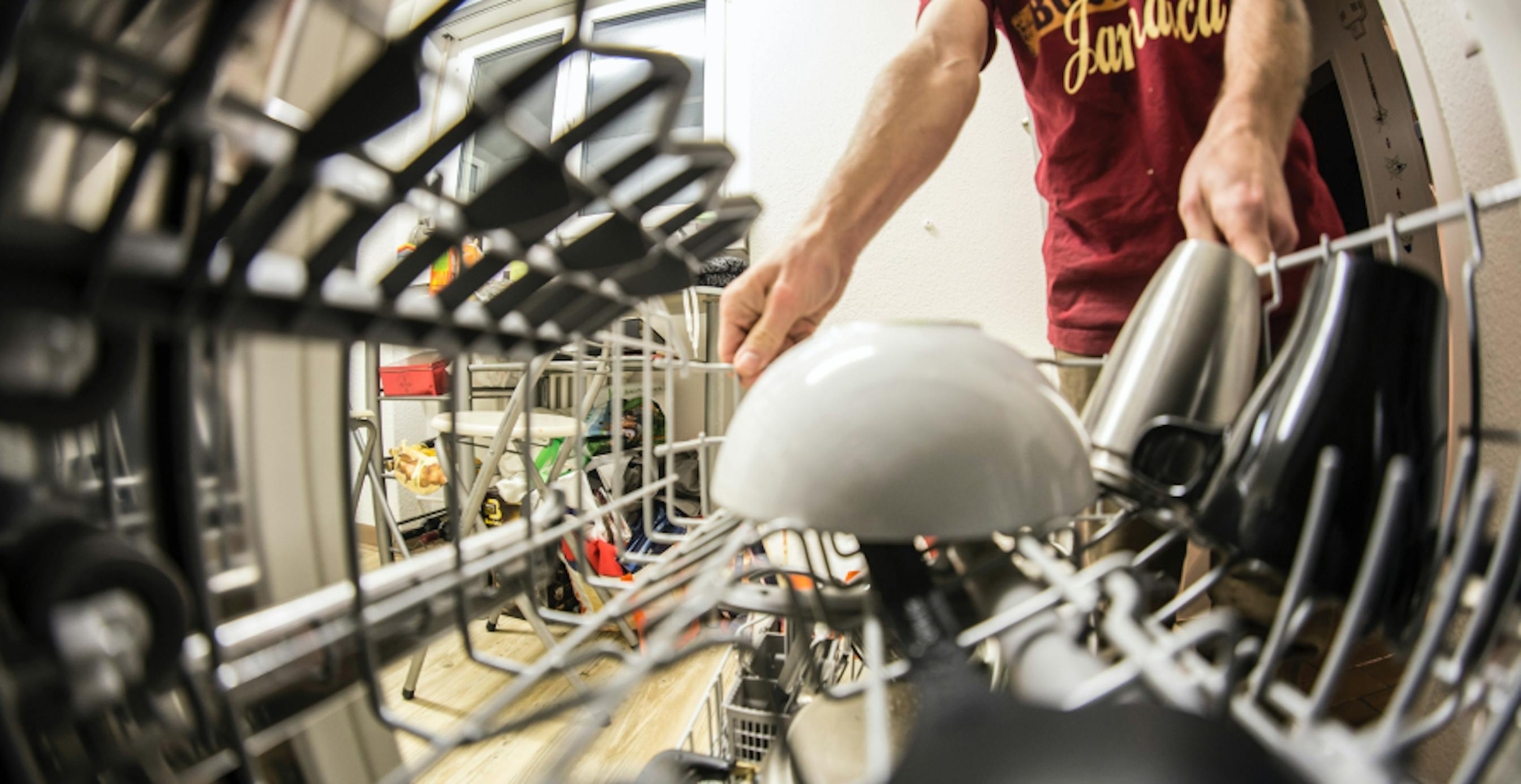 person loading dishwater