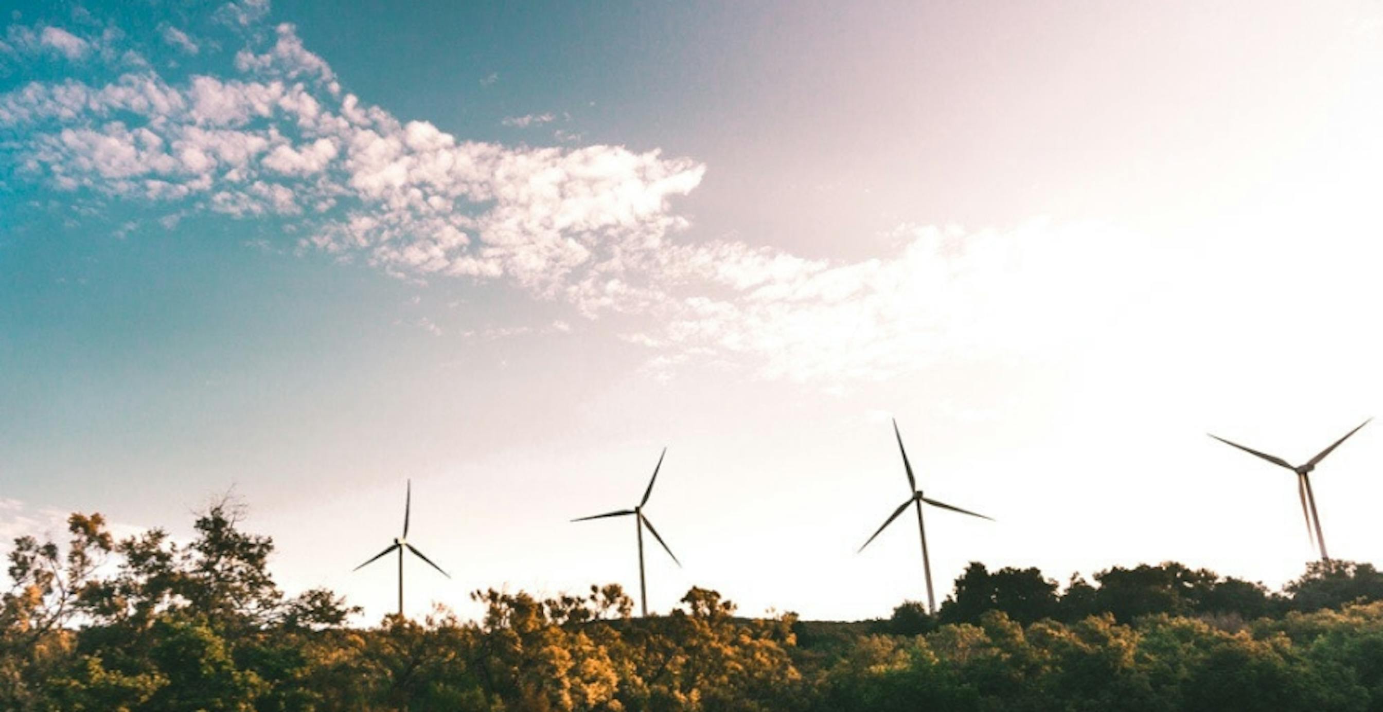 wind turbines in ombre sky