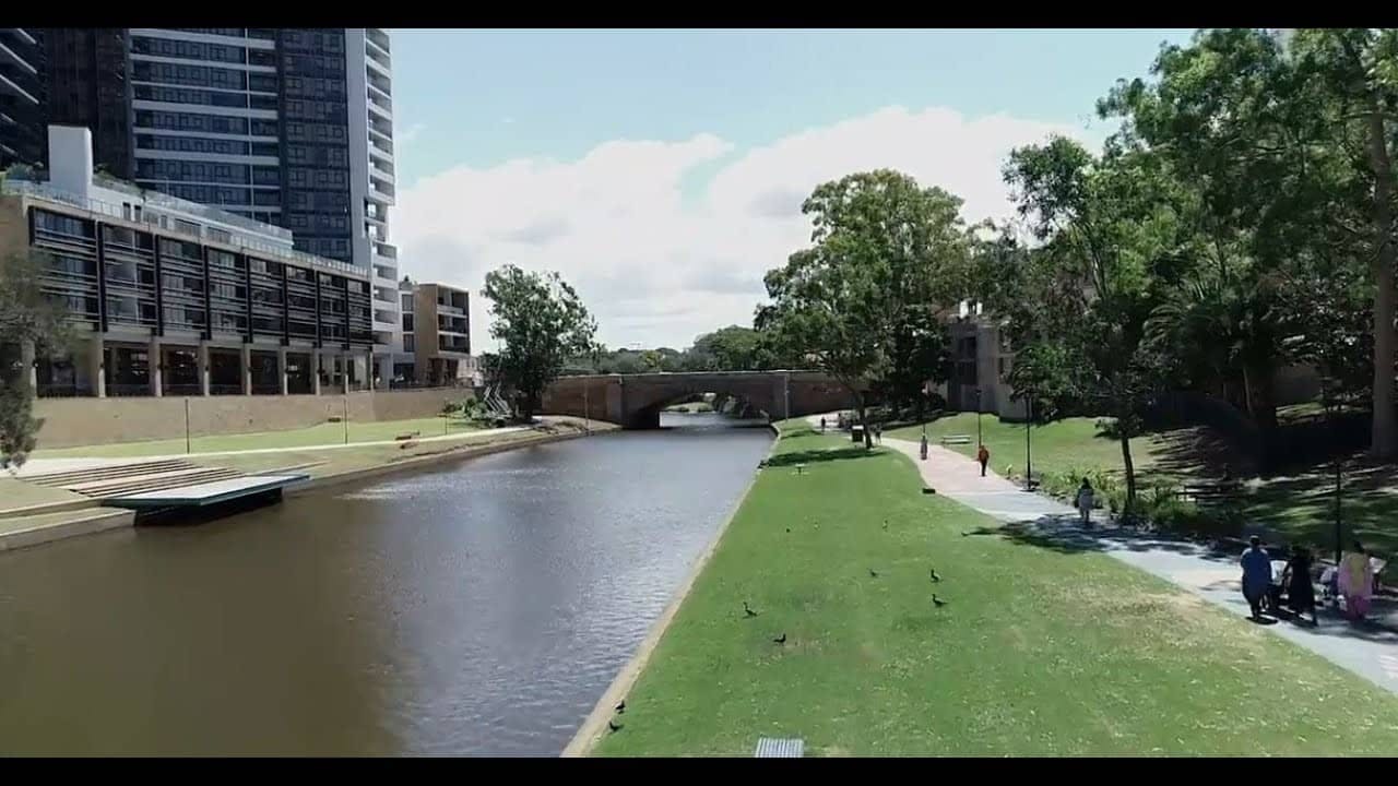 river and green stretch of grass