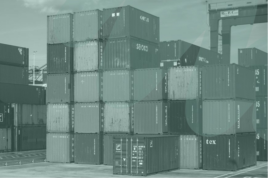 Stacked shipping containers at a port, representing supplier engagement across global supply chains.