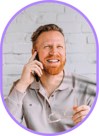 A smiling man on phone