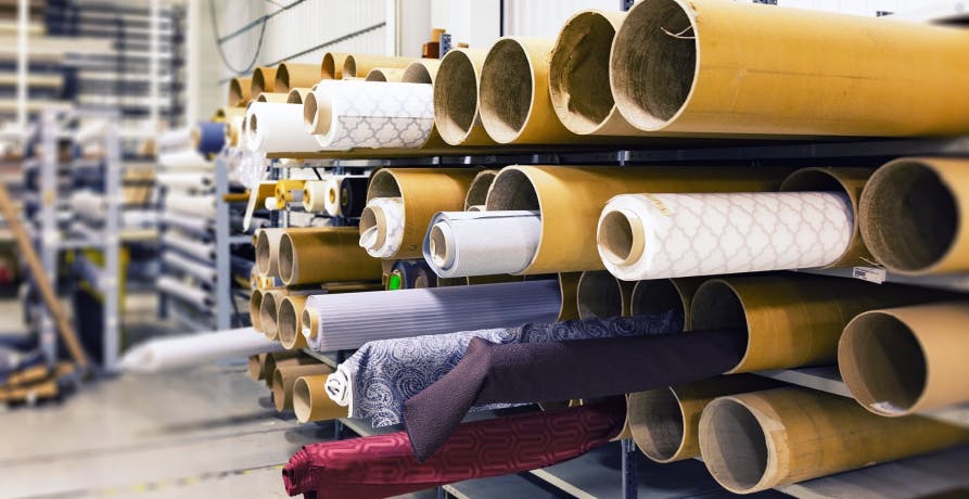 warehouse with rolls of textiles