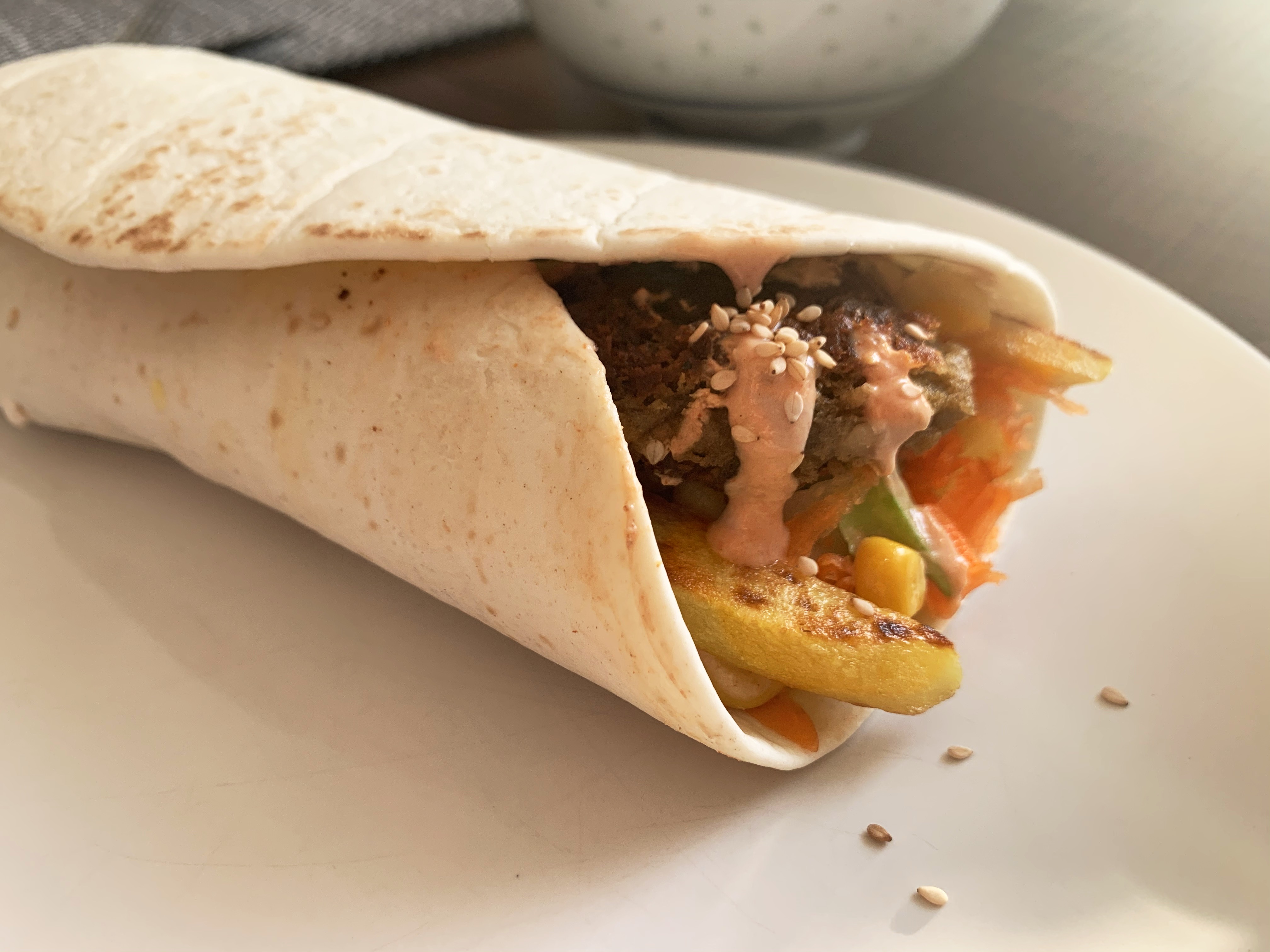 Insect falafel with fries and veggies wrapped in dough