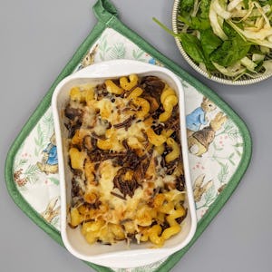 Comfort food mac and cheese straight from the oven with a salad on the side
