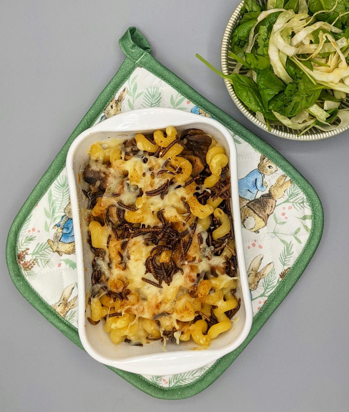 Comfort food mac and cheese straight from the oven with a salad on the side