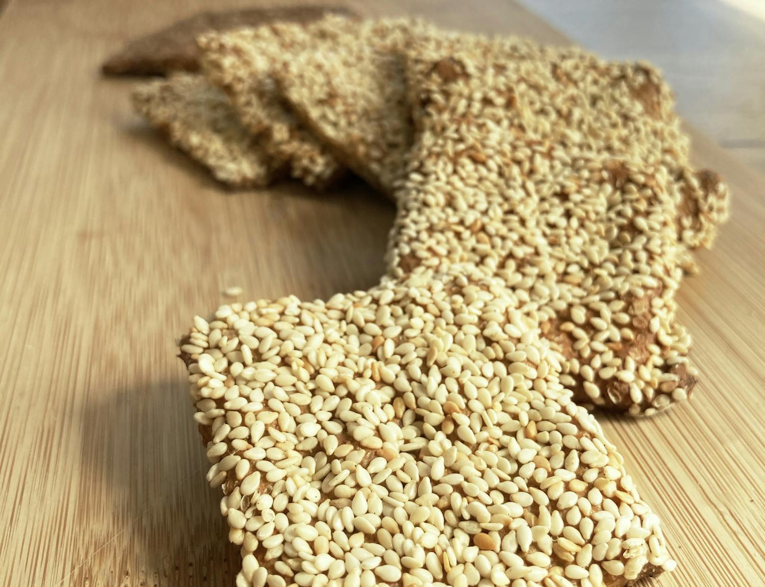 Sesame crackers on wooden board display