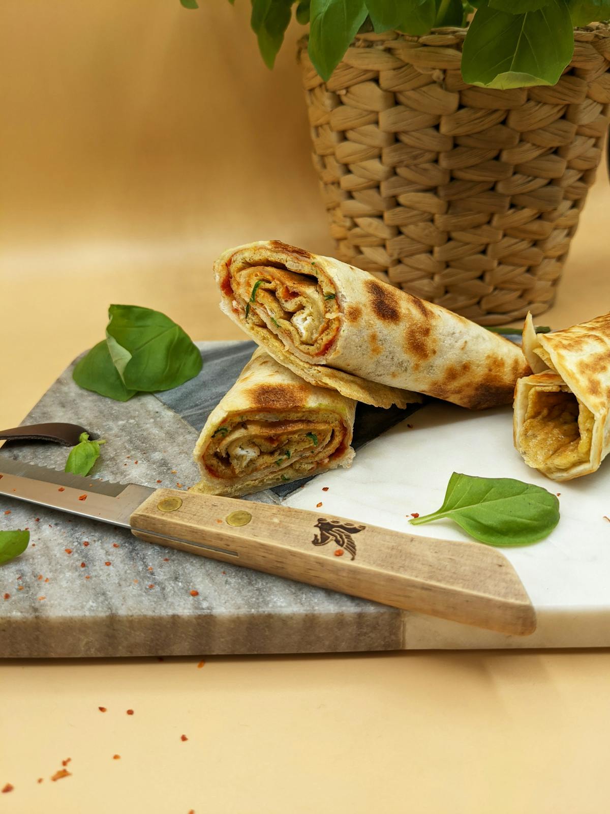 Cricket omelet rolls displayed on a cutting board