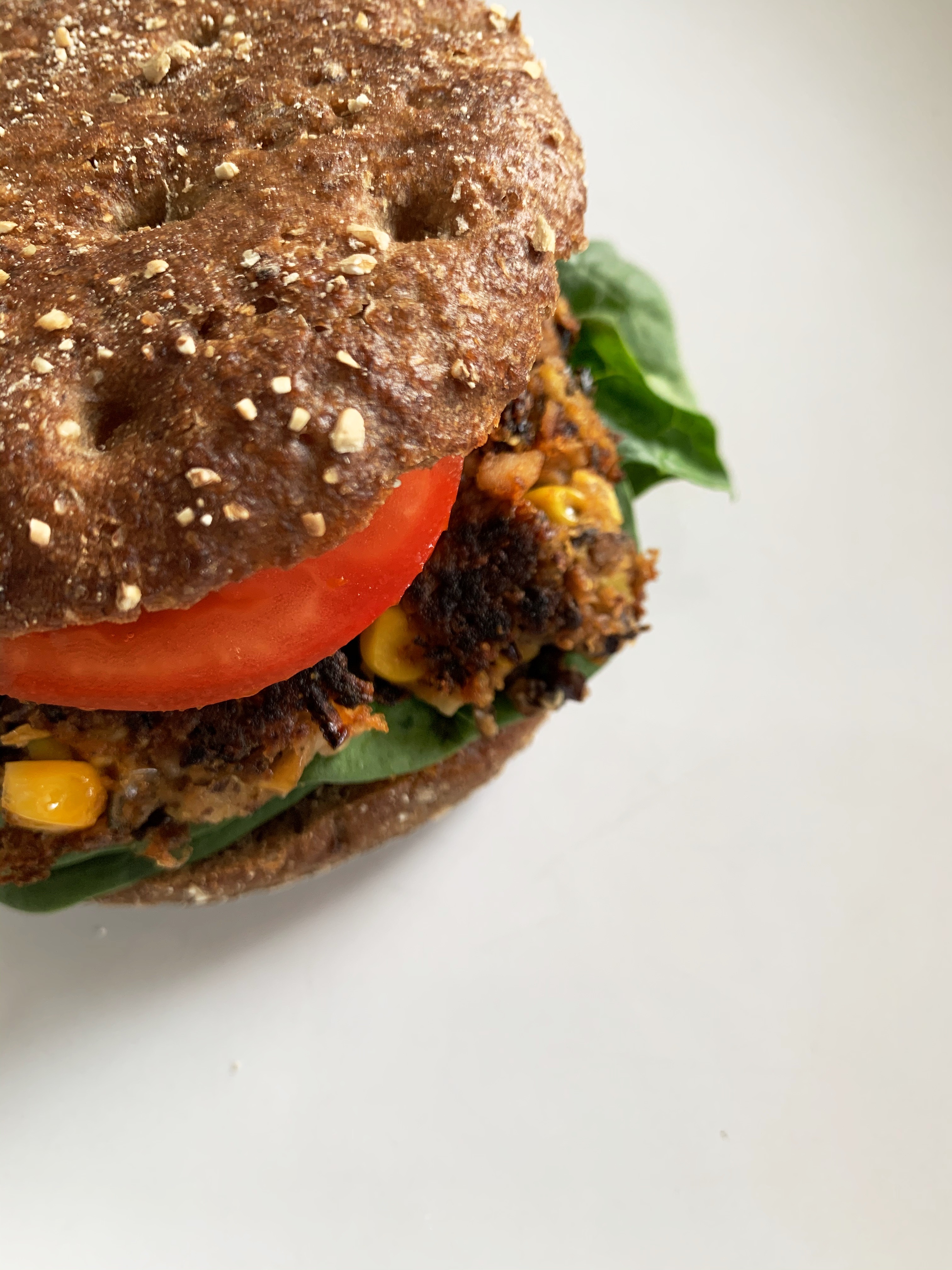 Top view of Buffaloworm Bean Burger in a crispy wholegrain bun