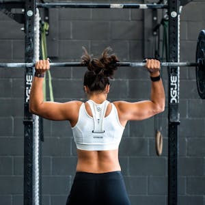 Girl holding up a barbell